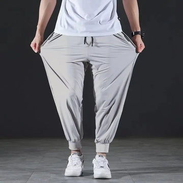 Summer Quick-drying Ice Silk Casual Pants Men's Ultra-thin Elastic Nine-point Pants Loose Drape Solid  Beam Feet Pants 7XL